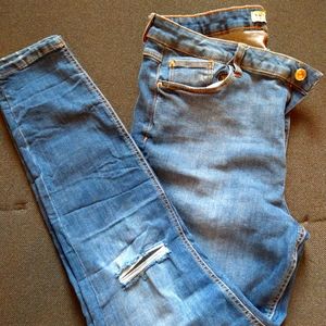 Distressed skinny jeans, bought at Primark